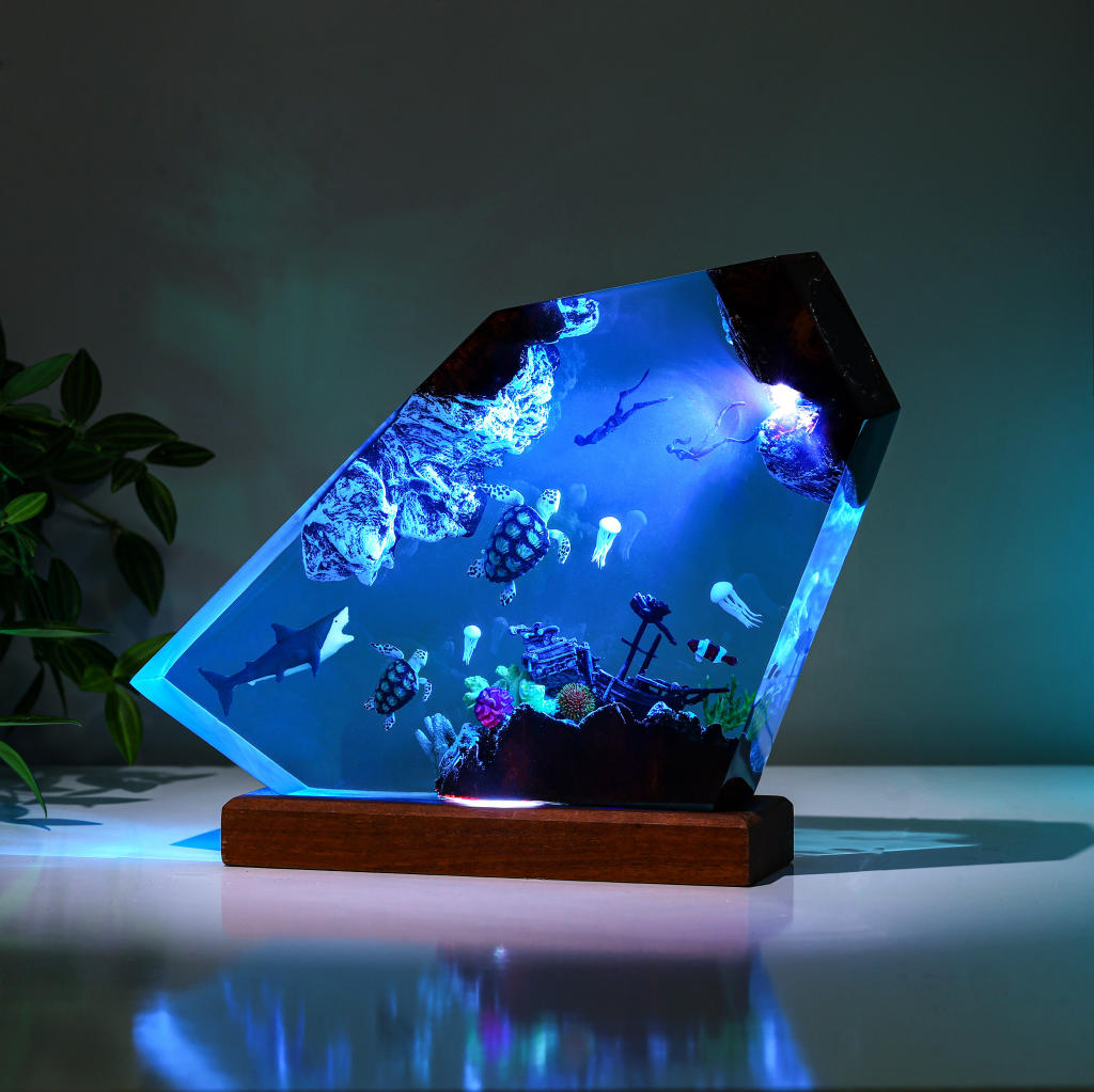 Orca and divers night light