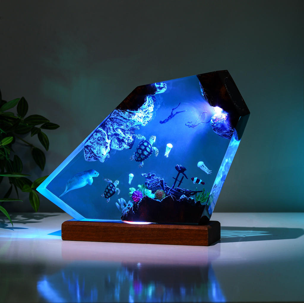 Orca and divers night light