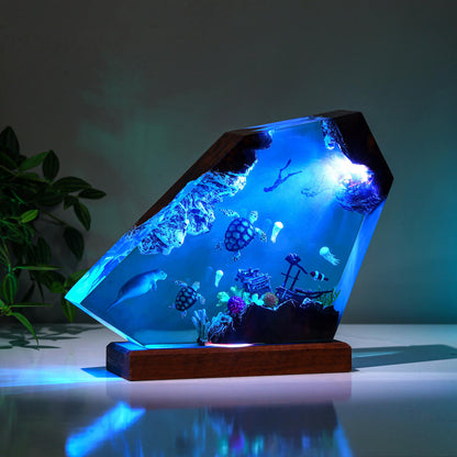 Orca and divers night light